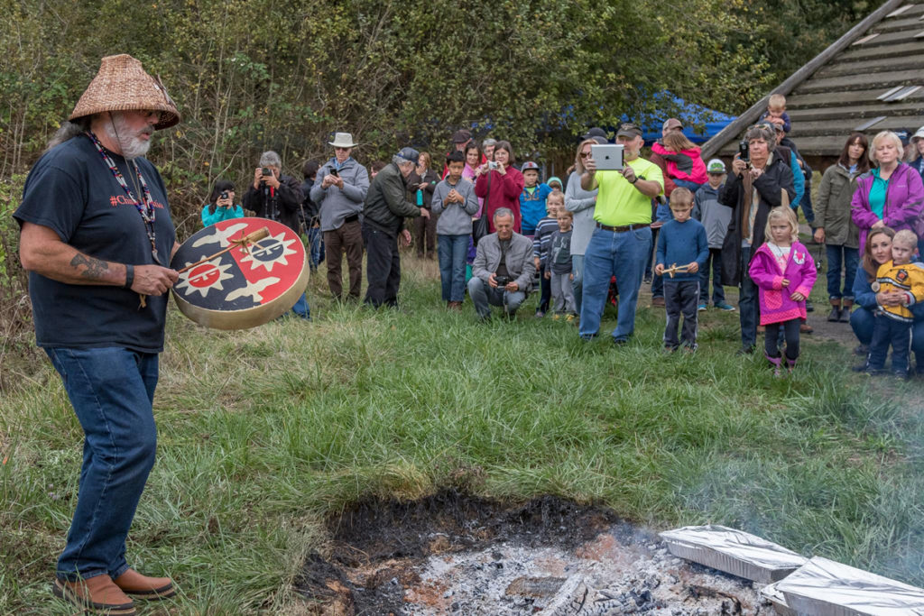 Chinook Tribal Vice Chairman, Sam Robinson playing a drum during the blessing of food and friendship before the traditional salmon bake at the Cathlapotle Plankhouse, Sun., Oct. 2 at the Carty Unit of the Ridgefield National Wildlife Refuge during Bird Fest. Photo by Mike Schultz.