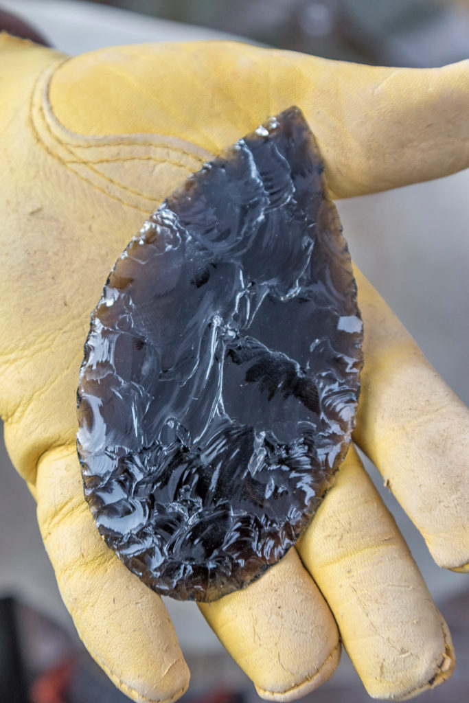 Dan Stueber, Portland displaying a Native American utilty tool he made from black obsidian. Photo by Mike Schultz.