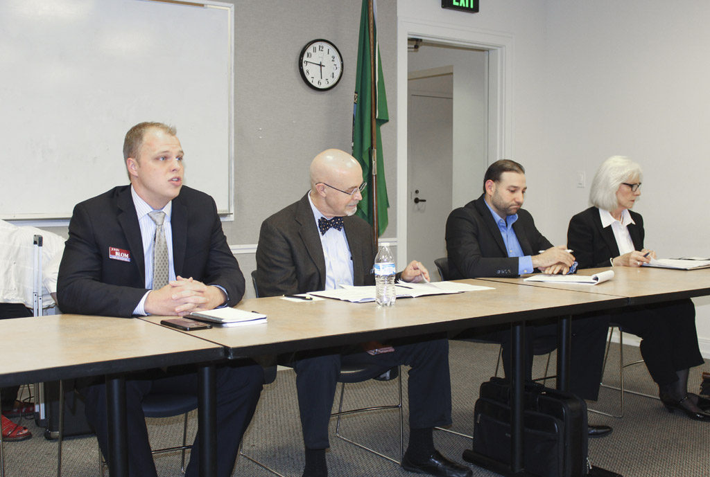 Candidates John Blom, Jim Moeller, Roman Battan and Eileen Quiring participated in a candidate forum Wednesday evening, held at the Camas Library and hosted by the Neighborhood Association Council of Clark County. Photo by Joanna Yorke