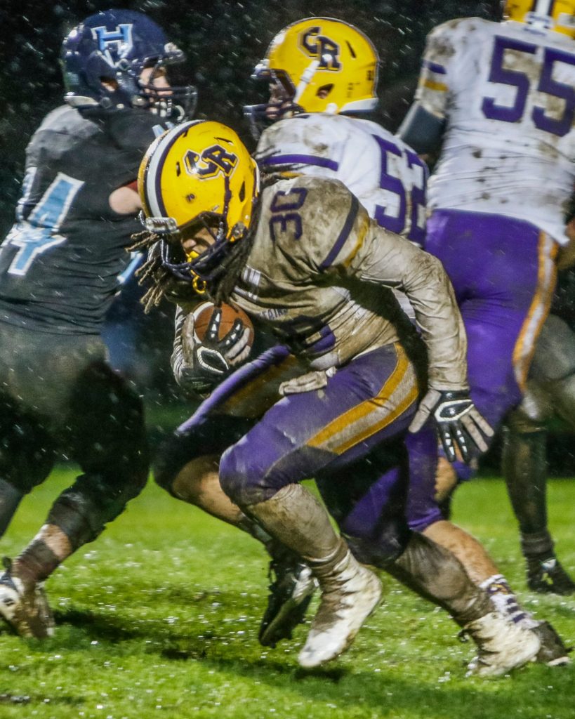 Columbia River running back Hunter Pearson (30) runs for a first down in the first half against Hockinson. Photo by Mike Schultz.