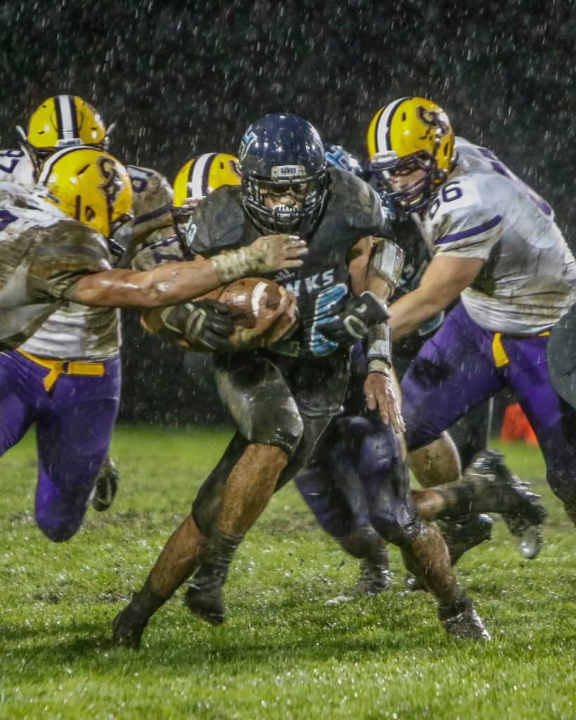 Hockinson running back Gannon Kytola (28) gains tough yardage against Columbia River. Photo by Mike Schultz