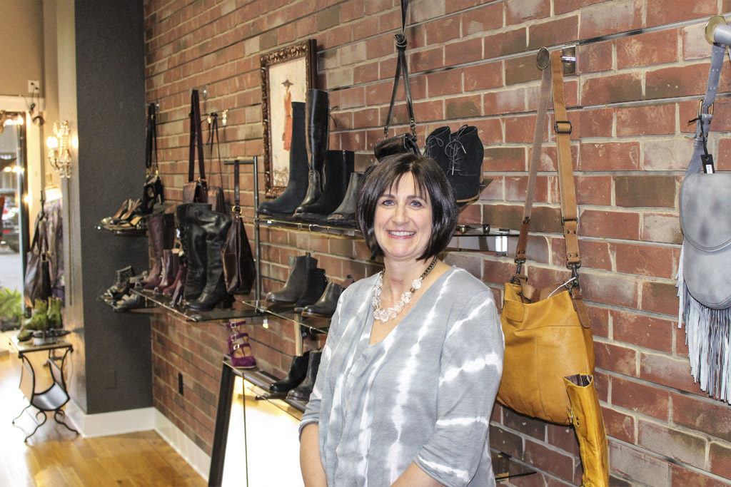 Ann Matthews, owner of Arktana, a boutique shoe store in downtown Camas, says she isn’t too fazed by the idea that a sales tax exemption allowing Oregon shoppers to avoid paying Washington sales tax might go away. Most of her out-of-state shoppers who qualify for the exemption either don’t bother filling out the required paperwork or they would still shop at Arktana even if they had to pay sales tax, Matthews says. Photo by Kelly Moyer