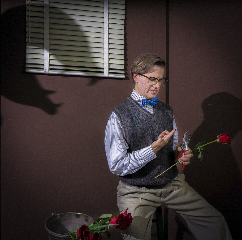 Caleb Bourgeois plays Seymour, the nerdy and in-love florist shop worker who finds himself caught up in an alien plant pod’s scheme to take over the world in the Magenta Theater’s production of ‘Little Shop of Horrors,’ which runs tonight, Oct. 3, through Sat., Oct. 22 in downtown Vancouver. Photo courtesy of the Magenta Theater.