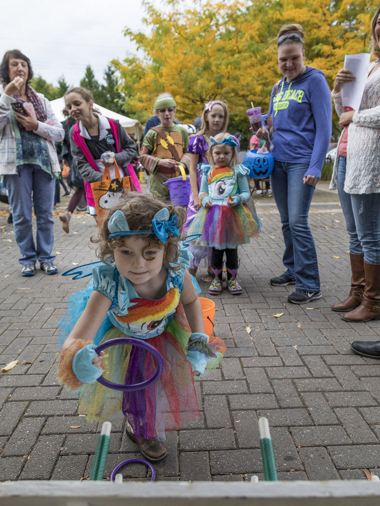 Four-year-old Sadie Johnson, of Washougal, shows off her talent at one of the activities offered Wednesday at the Downtown Washougal Pumpkin Harvest Festival. Photo by Mike Schultz