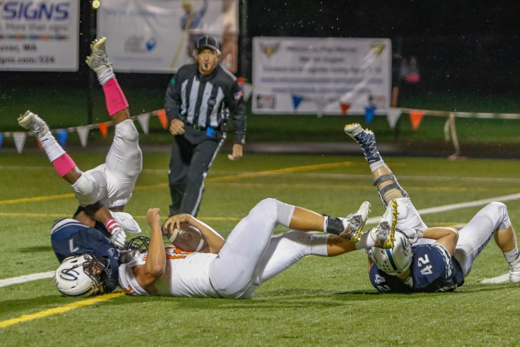 Skyview defenders Dyvon Green (7) and James Millspaugh (42) stop Battle Ground running back Curtis Stradley (12) short of the goal line. Photo by Mike Schultz.