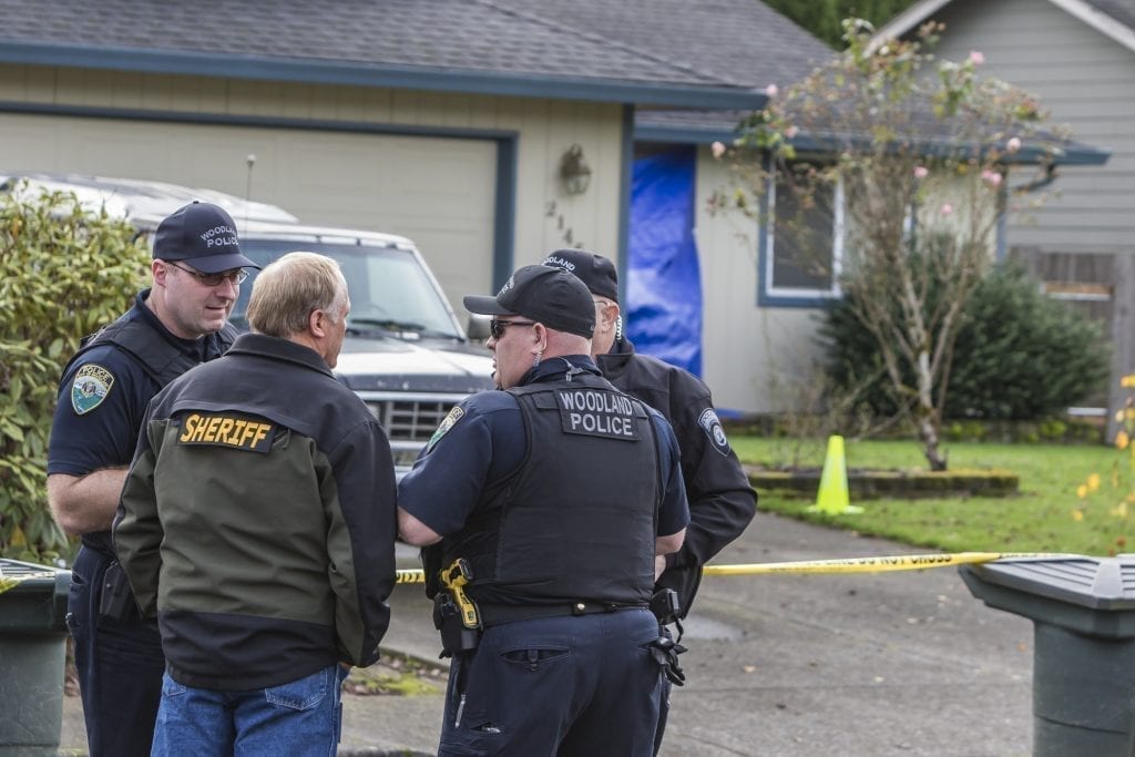 Personnel from the Cowlitz County Sheriff's Office, the Woodland Police Department and the Washington State Patrol Crime Lab continue to investigate the scene of an apparent homicide in Woodland. Photo by Mike Schultz