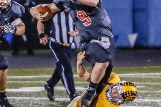 camas-high-school-football-quarterback-jack-colletto-escapes-tackle-enumclaw-high-school-football-defender