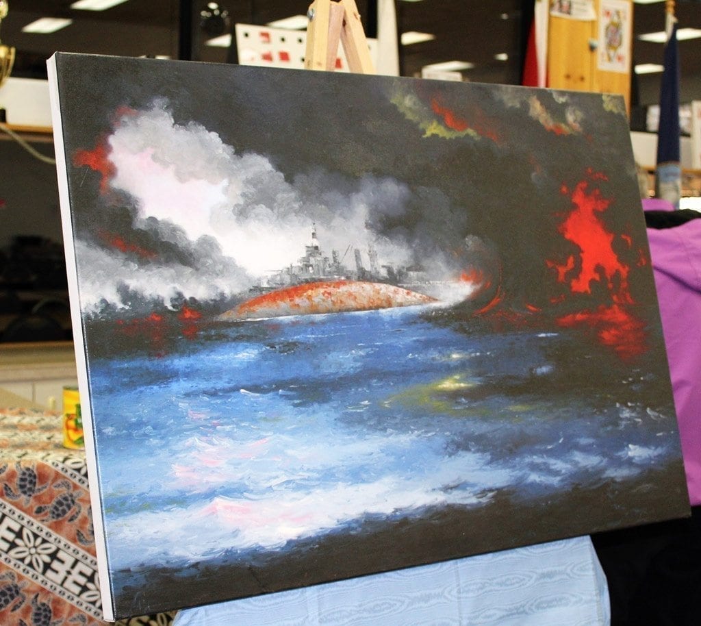 Gordon Sage, a Pearl Harbor survivor and former art teacher at Evergreen High School, painted this rendition of the Dec. 7, 1941 Japanese attack on the Pearl Harbor naval base. The painting was on display during the Pacific Northwest chapter of the Sons and Daughters of Pearl Harbor Survivors’ 75th anniversary remembrance event in Vancouver on Wed., Dec. 7. Photo by Kelly Moyer