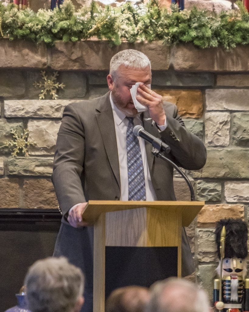 Battle Ground Council Member Shane Bowman wipes his eyes as he talks about his many memories of late Council Member Bill Ganley. Photo by Mike Schultz