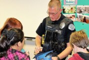 Vancouver Police Activities League, police officers share love of reading, stress gun safety with local third-graders