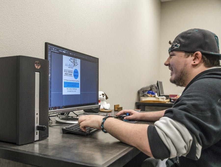 Joseph Wright is currently working as the graphic designer at Ink Ability, Battle Ground’s newest print shop, which opened for business on Feb. 6. Photo by Mike Schultz