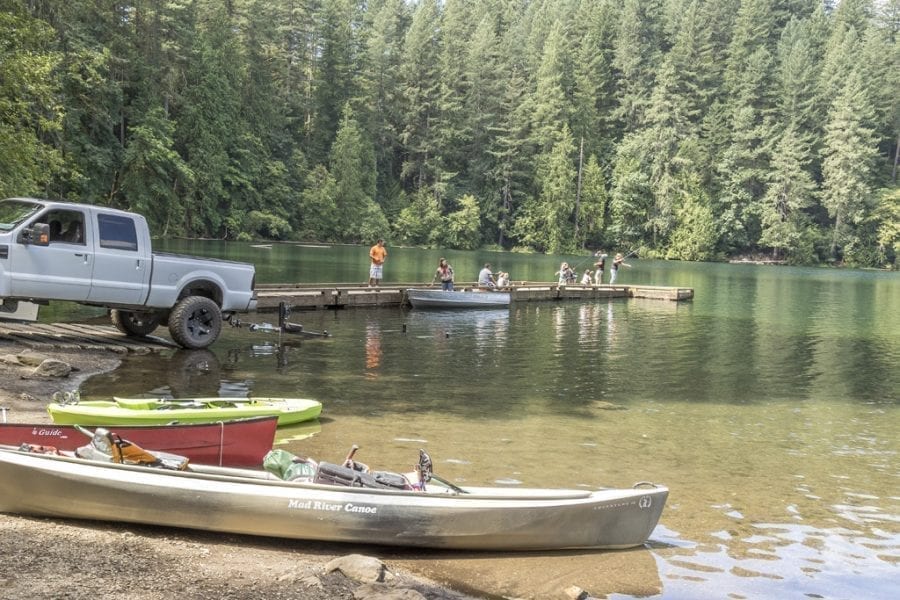 Battle Ground Lake, shown here, is a popular spot in Clark County for fishing and recreation.Trout fishing in Washington reaches full speed April 22, when several hundred lowland lakes – stocked with millions of fish – open for a six-month season. Photo by Mike Schultz