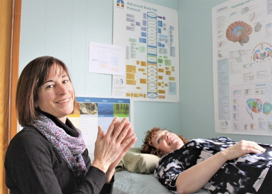 Lee Huntington, left, practices BodyTalk, a form of mind-body medicine that addresses the physical, emotional and social aspects of a person’s healing, on Kimberly Telegin (right) at Peace Yourself Together, 506 N.E. Everett St., Camas, on Tue., Feb. 28. The newly opened holistic health center will host a grand opening celebration from 5 to 8 p.m., Fri., March 3. Photo by Kelly Moyer