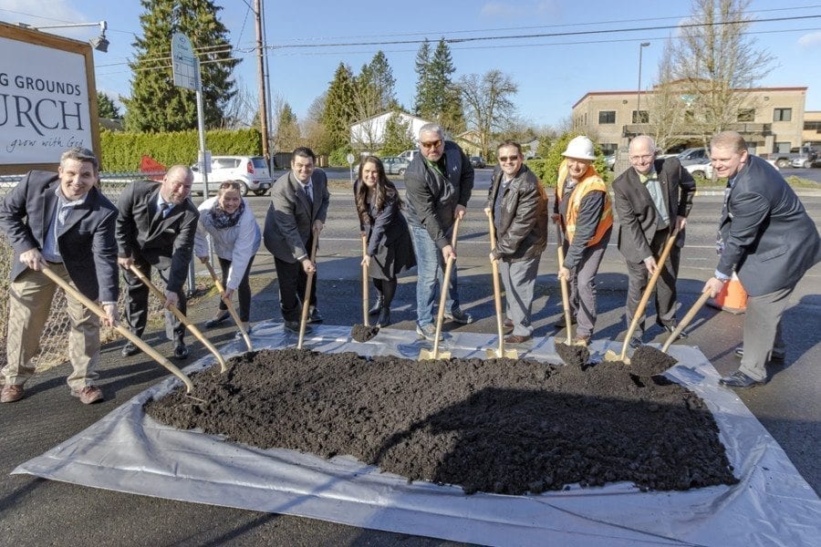 Several Battle Ground City Council members, the mayor, city staff and representatives from the state Transportation Improvement Board participated in ceremonially shoveling the “first” bit of earth to signify the groundbreaking of the South Parkway Improvement Project on Thursday morning. Photo by Mike Schultz