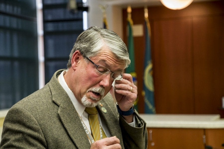 Clark County Manager Mark McCauley has a display of emotion at a special meeting Friday during which members of the Board of County Councilors voted unanimously not to renew his contract and terminate his employment immediately. Photo by Mike Schultz