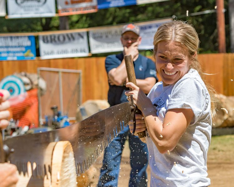 Sarah Johansen competes in the Jill and Jill competition at the Amboy Territorial Days logging competition Saturday in Amboy. Photo by Mike Schultz