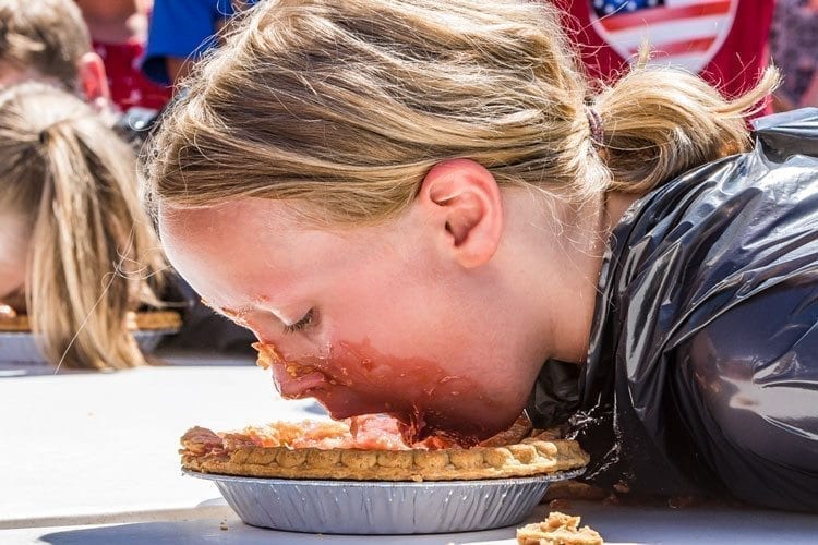 Chae Stark, a 9-year-old from British Columbia, Canada, participates in the Pie Eating Contest at the annual Ridgefield Fourth of July celebration Tuesday. Photo by Mike Schultz