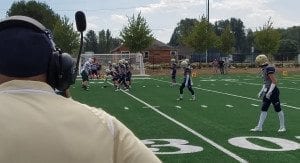 Seton Catholic coach Will Ephraim looks on as his team sets up for a play at the school's new field Saturday. Photo by Paul Valencia