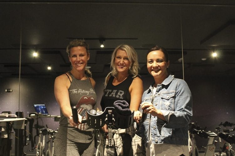 Salina Philbrook, Eryn Washington and Erica Gehlen recently opened StarCycle Felida, which offers music-based indoor cycling classes. Photo by Alex Peru