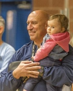 Hockinson football coach Rick Steele enjoys Friday’s assembly celebrating the Hawks’ state championship with granddaughter Lucy. Photo by Mike Schultz