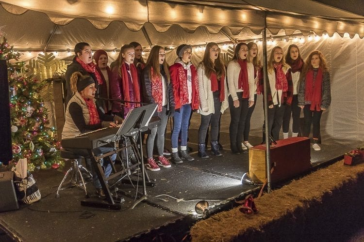 The La Center High School Select Choir sang Christmas carols to entertain visitors at La Center’s annual Christmas Festival on Sunday evening. Photo by Mike Schultz
