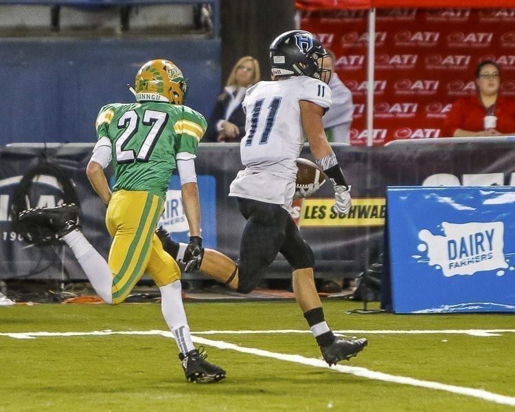 Hockinson sophomore receiver Sawyer Racanelli (11) races to the end zone on one of his three touchdowns Saturday in the Class 2A state championship game at the Tacoma Dome. Photo by Mike Schultz
