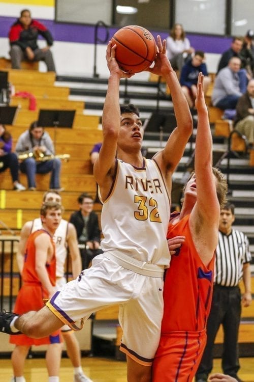 Columbia River’s Nasseen Gutierrez (32), who led the team in rebounds against Ridgefield Friday, said it one of the keys to success this season as been the sharing of the spotlight between teammates. Photo by Mike Schultz