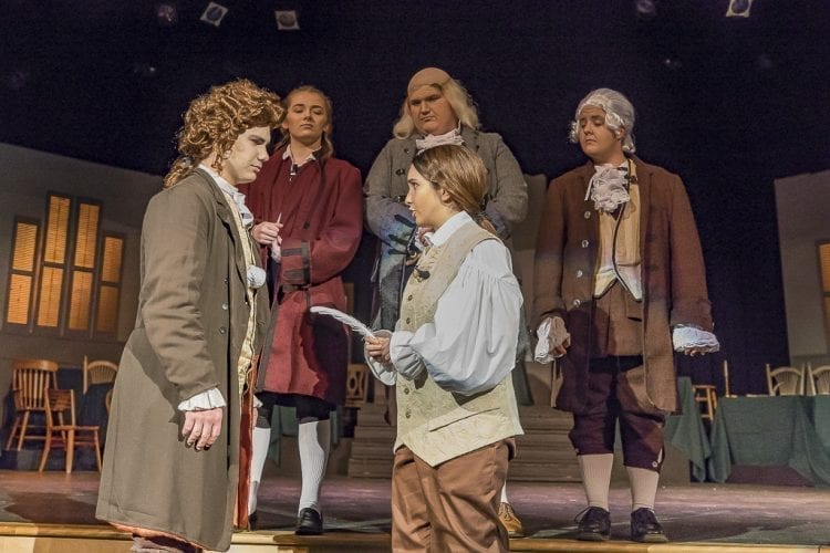 Joshua O’Keefe (left) as Thomas Jefferson and Rowan Segura as John Adams argue over who should get the pen, who should write the Declaration of Independence in Heritage High School’s production of “1776.” Photo by Mike Schultz