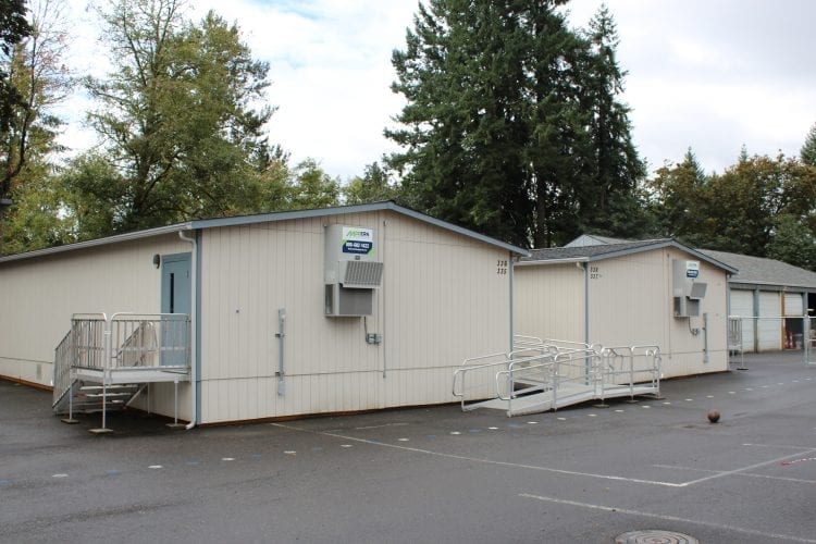 The proposed La Center School District bond, which will pay for a new middle school, is intended to help reduce crowding and compensate for population growth in the district. Portable classrooms have been used in the past, but the district is running out of spaces to put them, and looking at using sports practice fields to house more portables as they become needed. Photo by Alex Peru