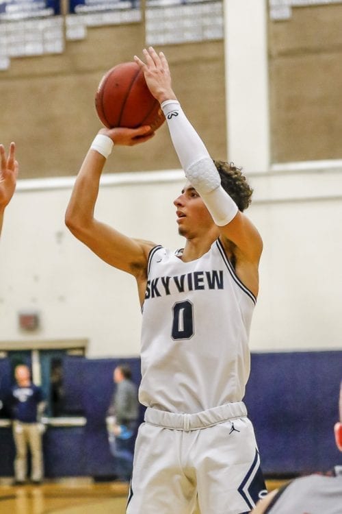 Skyview’s Alex Schumacher (0) scored 11 of his game-high 23 points in the final three minutes to lead the Storm to a 59-55 win over Union in Class 4A Greater St. Helens League boys basketball action Friday at Skyview High School. Photo by Mike Schultz