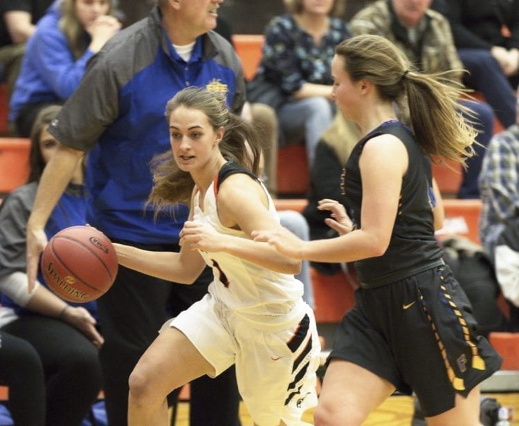 Alexis Maniscalco of Washougal drives past a defender during Saturday’s win over Fife. Maniscalco came off the bench and provided quite the lift with her rebounding and passing, helping the Panthers to a 19-2 run to end the first half. Photo courtesy of Glen Erickson