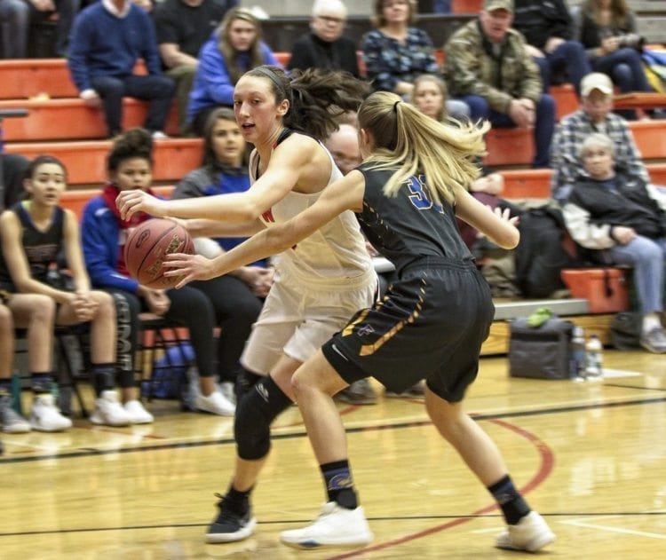 Beyonce Bea (5) had 14 points, 13 rebounds, four assists, and three blocked shots Saturday, helping the Washougal Panthers advance to Yakima as one of the 12 remaining teams in the Class 2A state tournament. Photo courtesy of Glen Erickson
