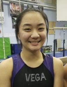 Camas’ Alyssa Shibata was the team’s final athlete on the uneven bars. She stuck her routine, and her score helped the Papermakers to a team championship. Photo by Paul Valencia