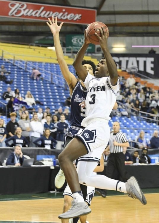 Samaad Hector drives to the hoop at the Class 4A state boys basketball tournament Wednesday at the Tacoma Dome. Hector scored the winning basket with less than five seconds left, lifting the Storm past Glacier Peak 68-67. Photo courtesy of Kris Cavin
