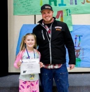 Student attendance is vital to academic growth so the school awards special certificates to students who maintain perfect attendance over a three-month period (like Maelee Nichols, pictured here with her dad). Photo courtesy of Woodland School District