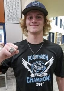 Hockinson’s Wyatt Jones poses with his new ring while wearing the 14-0 state championship T-shirt. The Hawks picked up their championship rings Monday, another opportunity for the team to celebrate one more time. Photo by Paul Valencia