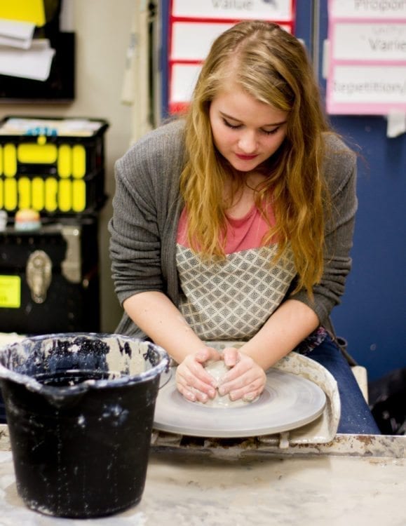 Students like Maddison Wale (8th grader, pictured here) wanted more time with the throwing wheel and encouraged teacher Nicole Caulfield to create the after-school club. Photo courtesy of Woodland Public Schools