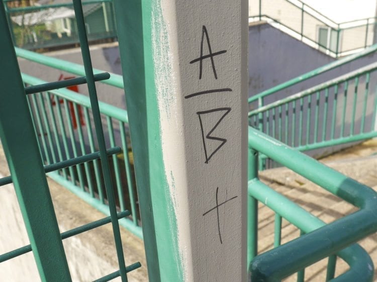Tagging seen on a pedestrian overpass along Padden Parkway near 137th Avenue in Vancouver. Photo by Chris Brown