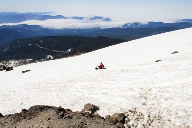 A man glissades down the slopes of Mount St. Helens. Photo by Eric Schwartz