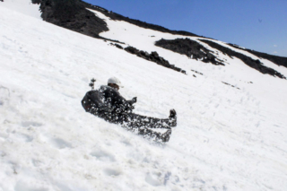 A man glissades down the slopes of Mount St. Helens Tuesday.jpg A man glissades down the slopes of Mount St. Helens Tuesday. Photo by Eric Schwartz