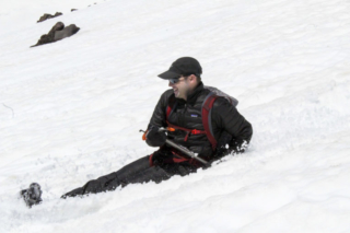 A man smiles while glissading down Mount St. Helens Tuesday A man smiles while glissading down Mount St. Helens Tuesday. Photo by Eric Schwartz