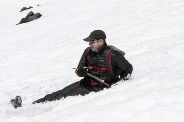 A man smiles while glissading down Mount St. Helens Tuesday. Photo by Eric Schwartz