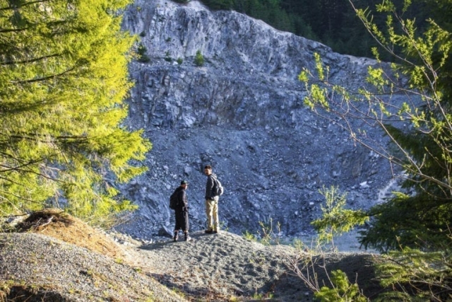 A pair of hikers take in the scenery near the start of the path to the summit. Photo by Eric Schwartz