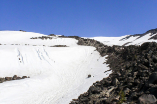 A rocky ridge points the way toward the summit of Mount St. Helens A rocky ridge points the way toward the summit of Mount St. Helens. Photo by Eric Schwartz