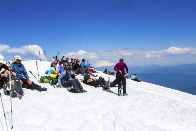 Climbers rest at the summit of Mount St. Helens Tuesday. Photo by Eric Schwartz