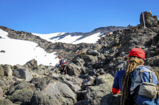 Hikers make their way through a boulder field Hikers make their way through a boulder field. Photo by Eric Schwartz