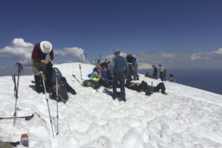 Hikers rest at the summit of Mount St. Helens Tuesday Hikers rest at the summit of Mount St. Helens Tuesday. Photo by Eric Schwartz