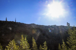 The sun shines behind a boulder field at Mount St. Helens The sun shines behind a boulder field at Mount St. Helens. Photo by Eric Schwartz