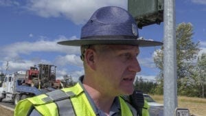 WSP Trooper Will Finn at the scene of an overturned semi truck that was carrying chickens Monday in Dollars Corner. Photo by Chris Brown