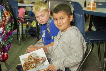 Book Buddies at Woodland Intermediate School work together to improve reading skills
